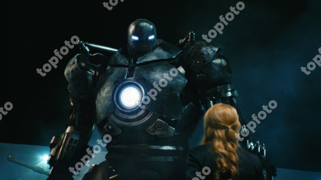 The evil Iron Monger confronts Pepper Potts (Gwyneth Paltrow, front) in the  film Iron Man - TopFoto