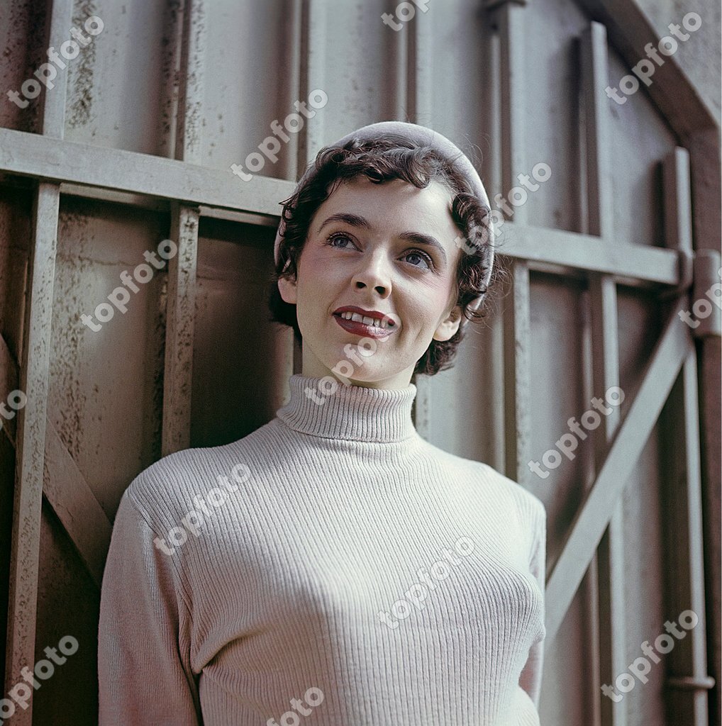 1950s jumper fashion. A swedish young woman wearing a typical 50s sweater.  Under it she is