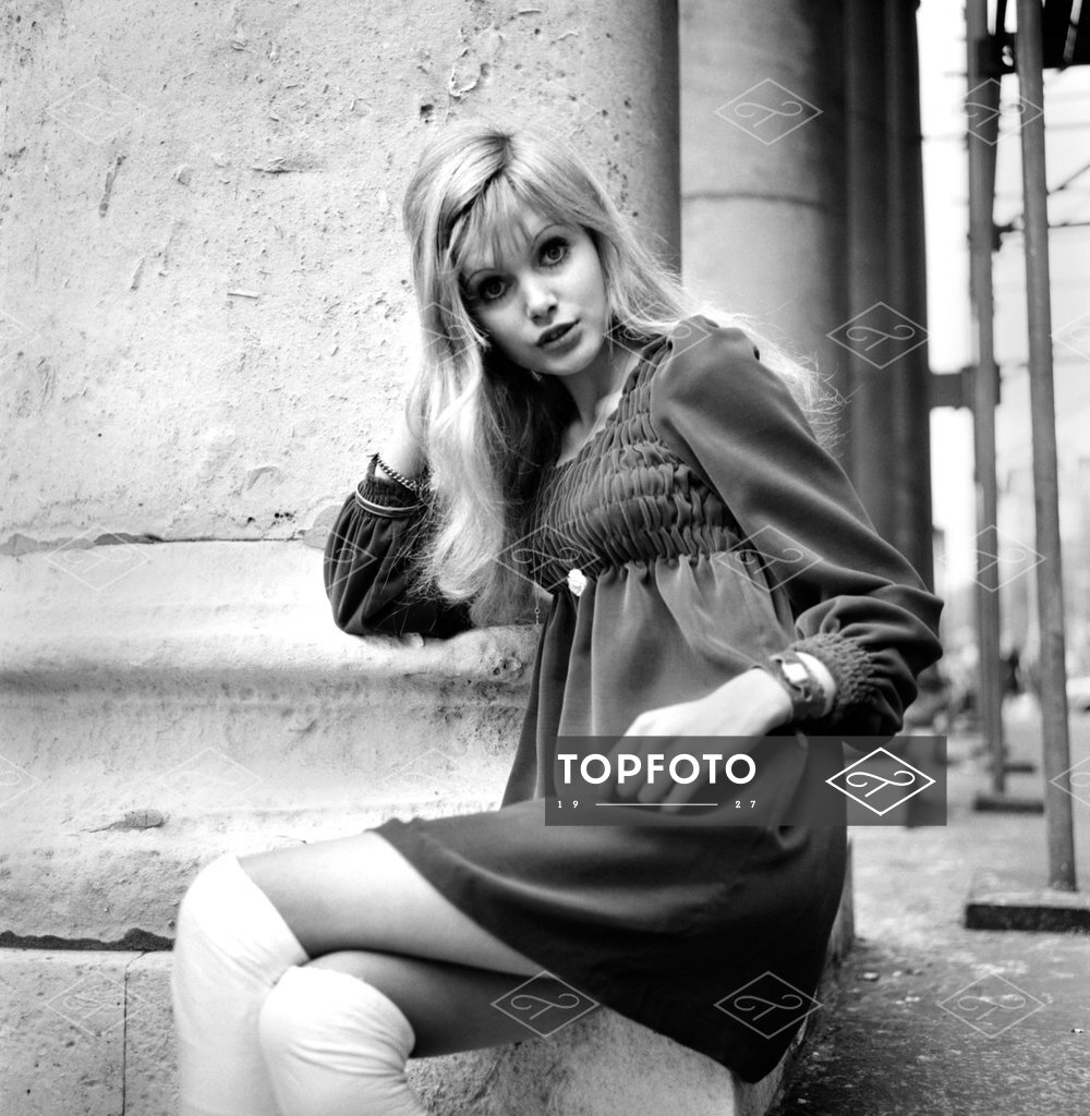 Actress and model Maddy Smith a.k.a. Madeline Smith aged 20 photographed in  London wearing a black dress and white knee high boots November 1969  Z10608-010 - Topfoto Image Archive