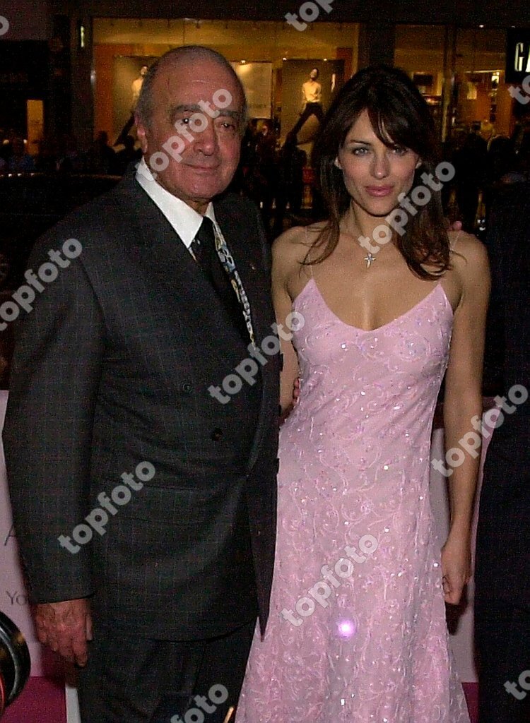 Liz Hurley with Harrods boss Mohamed Al Fayed switching on the lights Harrods,